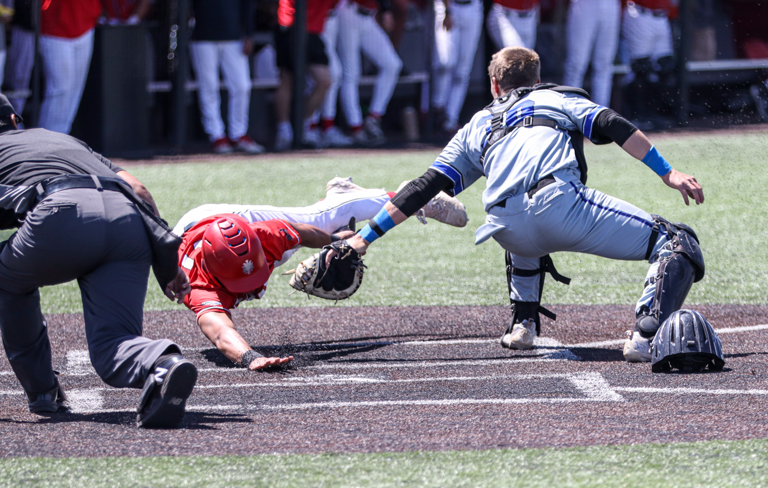 AC catcher Gabe Compton tags out a runner on a stolen base attempt during game three vs. NMMI in Roswell.